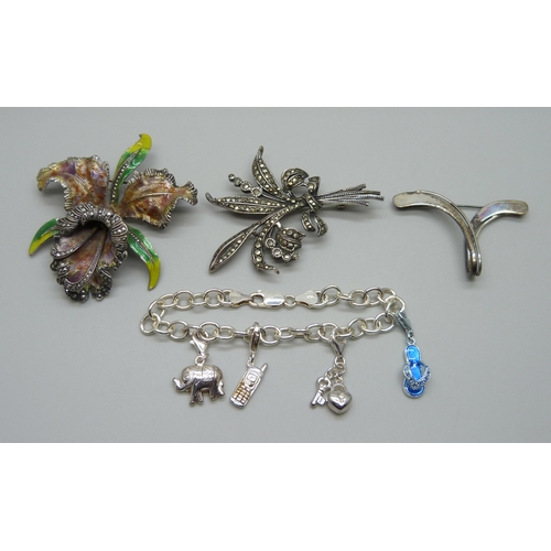 977 - A large white metal and enamel flower brooch, a silver bracelet and two silver brooches, 38g of mark... 