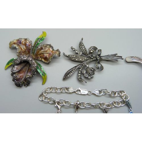 977 - A large white metal and enamel flower brooch, a silver bracelet and two silver brooches, 38g of mark... 