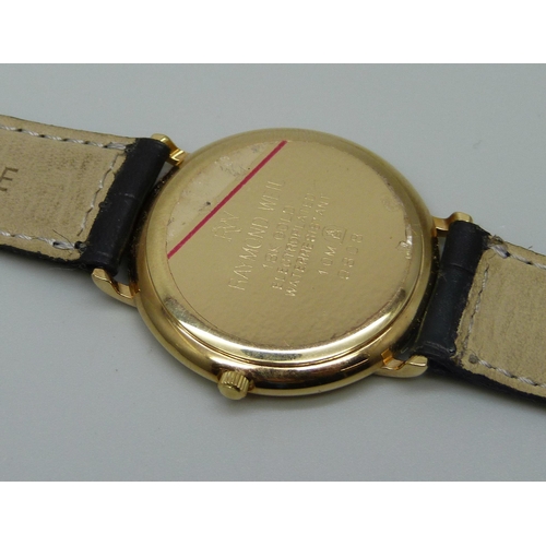 983 - A gentleman's Raymond Weil 18K gold plated wristwatch