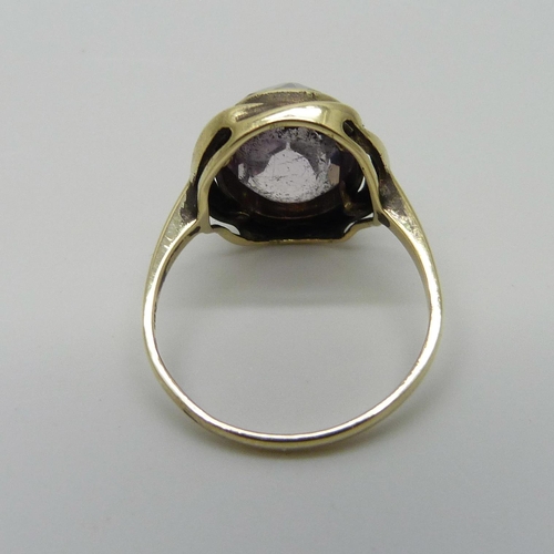 994 - A 14ct gold ring set with an amethyst, stone upside down, 4.6g, R