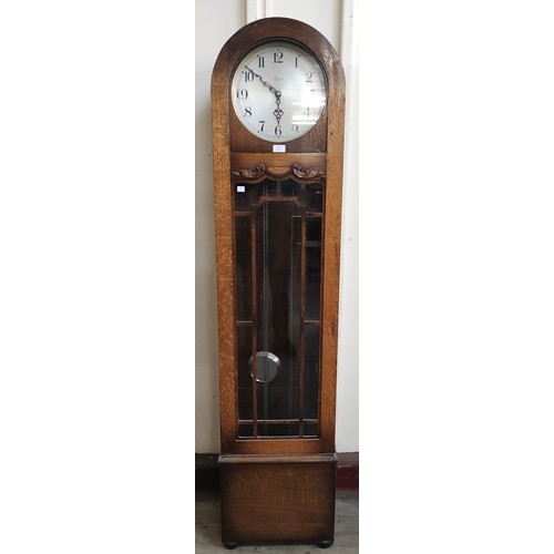 225 - An Art Deco oak longcase clock, the dial signed Tymo