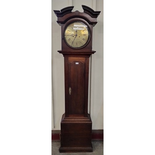 227 - A 19th Century carved oak longcase clock, the brass dial signed W. Bate, Nottingham