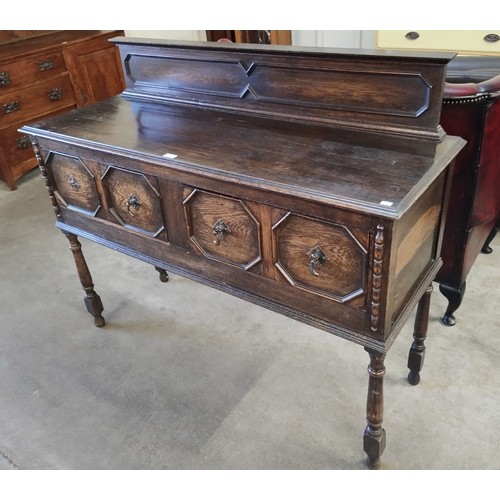 229 - An Edward VII carved oak sideboard