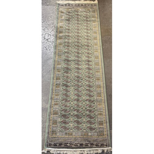 213C - A Pakistani Boghara hand knotted green ground runner (275cm x 75cm)