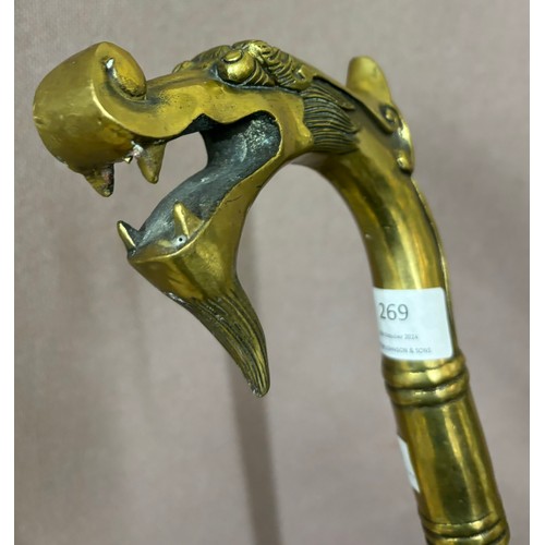 269 - An Oriental brass dragons head handled walking cane