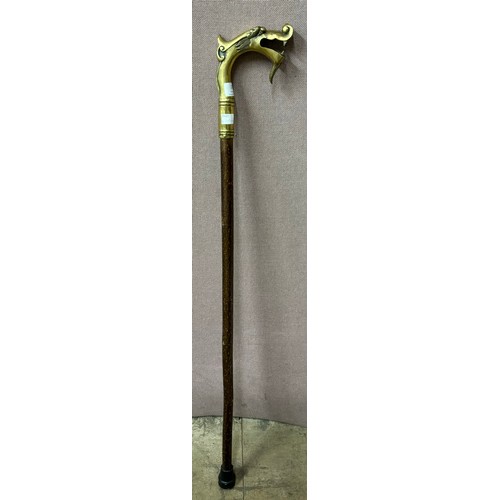 269 - An Oriental brass dragons head handled walking cane