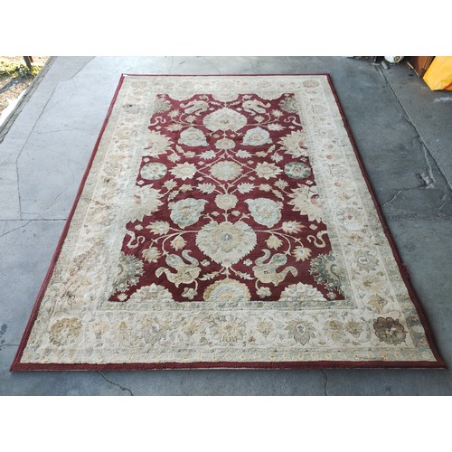 235 - An red ground rug