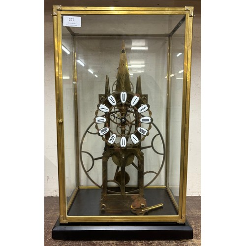 274 - A cased gilt metal skeleton clock