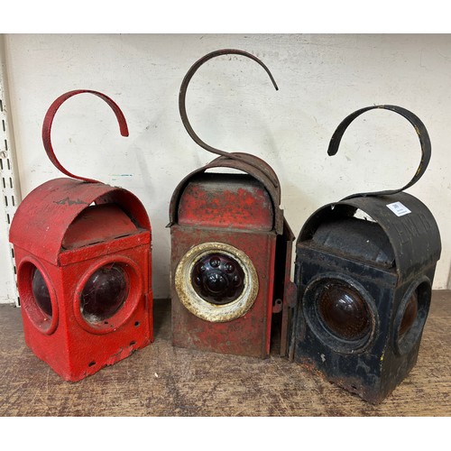 289 - Three early 20th Century road safety lanterns