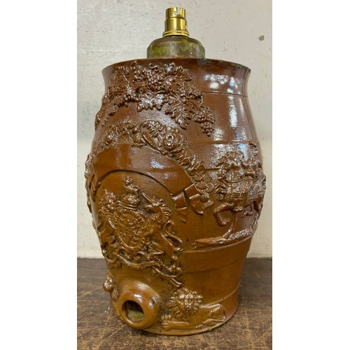 298 - A stoneware water urn, bearing British royal coat of arms, converted to a table lamp