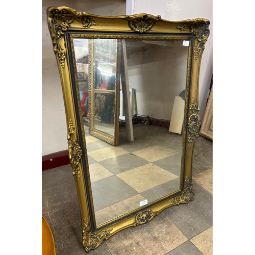 306 - A gilt framed mirror, 80 x 57cms