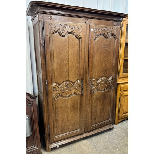 240A - A 19th Century French provincial oak armoire