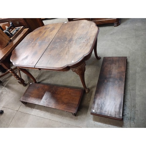 239 - A Queen Anne style walnut extending dining table