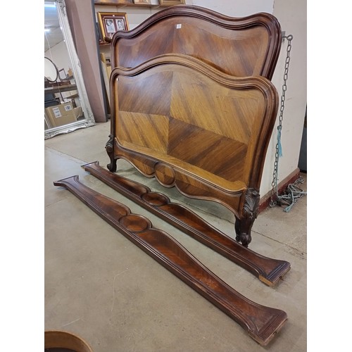 242 - A late 19th Century French carved oak and rosewood bed