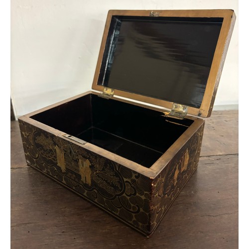 273A - A chinoisere black lacquered jewellery box