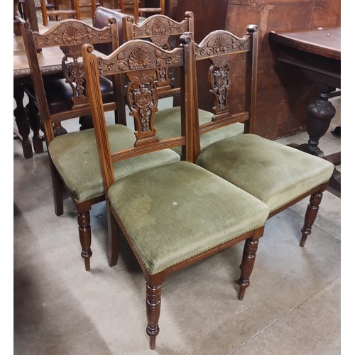 215 - A set of four Victorian carved mahogany dining chairs