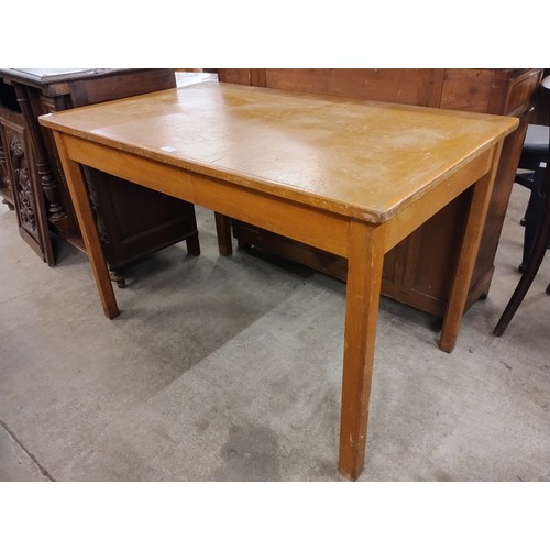 220 - An oak and leather topped desk