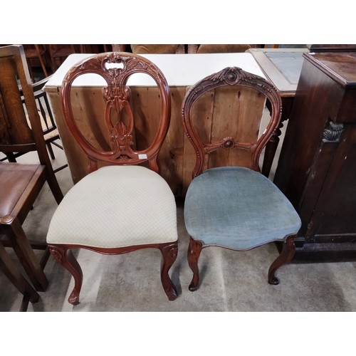 223 - Two Victorian carved mahogany balloon back dining chairs