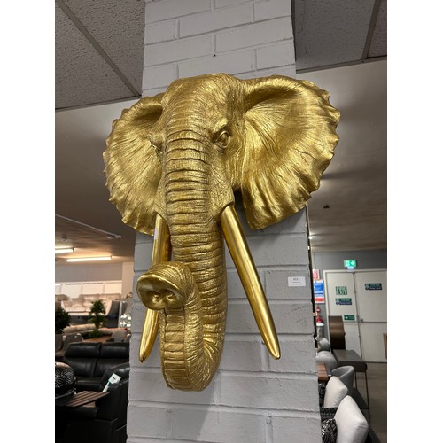 3113 - A large gold bust of an elephant