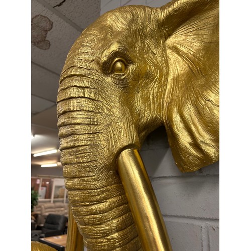 3113 - A large gold bust of an elephant