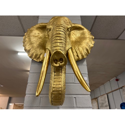 3113 - A large gold bust of an elephant