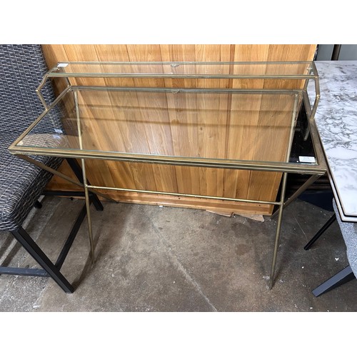 3170 - A gold and glass desk