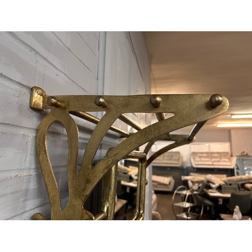 3071 - A gold painted wall mounted coat rack