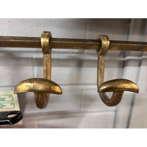 3071 - A gold painted wall mounted coat rack