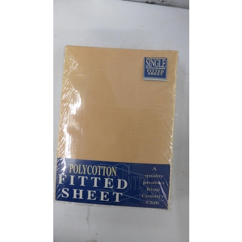 5243 - A large quantity of assorted bed linen including pillow cases, fitted sheets and sheet sets, etc.