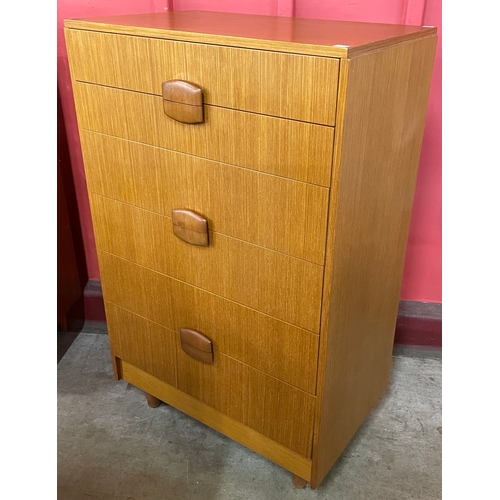 2 - A teak chest of drawers