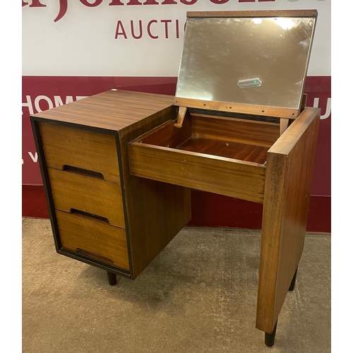 18 - A Stag C-Range tola wood and black dressing table, designed by John & Sylvia Reid