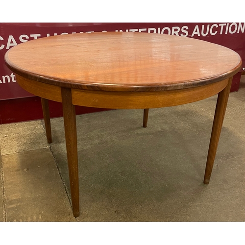 21 - A G-Plan Fresco teak circular extending dining table