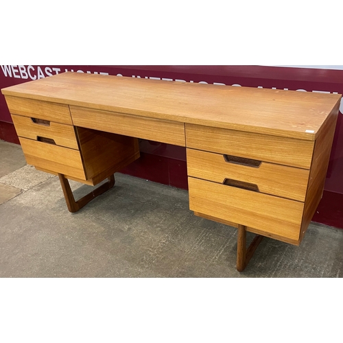 34 - A Uniflex teak desk