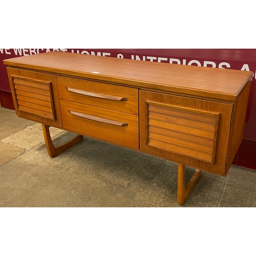 36 - A teak sideboard