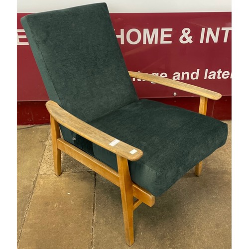 61 - A teak and blue fabric upholstered lounge chair