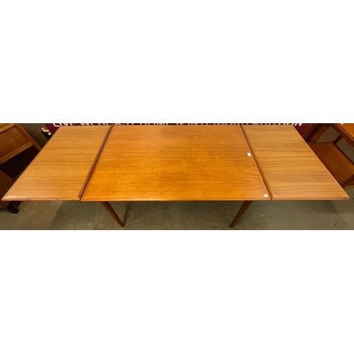 47 - A Danish teak draw-leaf dining table