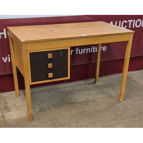 63 - A Danish Domino Mobler oak desk