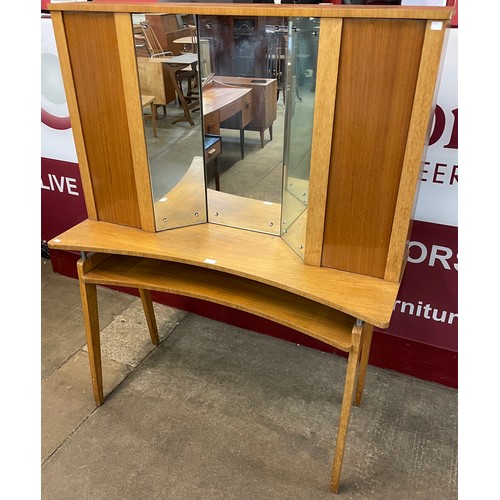 57 - A teak dressing table