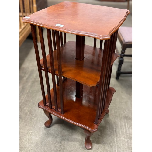 132 - A Victorian style mahogany revolving bookcase