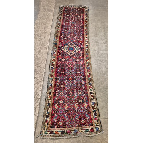 168 - Two Eastern hand knotted woollen runner rugs, 87 x 324cms and 69 x 292cms