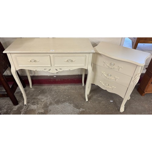 148 - A French style painted chest of drawers and a similar two drawer console table