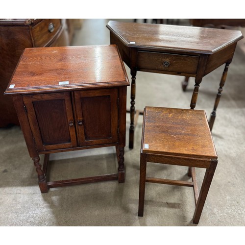 152 - An oak stool, an oak barleytwist credence cupboard and an oak single drawer side table