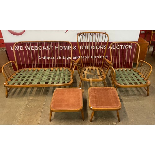 66 - An Ercol Golden Dawn beech five piece lounge suite, comprising; studio couch, pair of armchairs and ... 