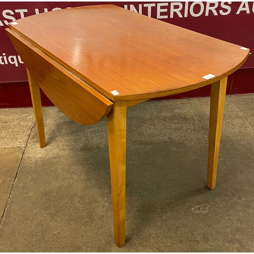 67 - A teak drop leaf dining table