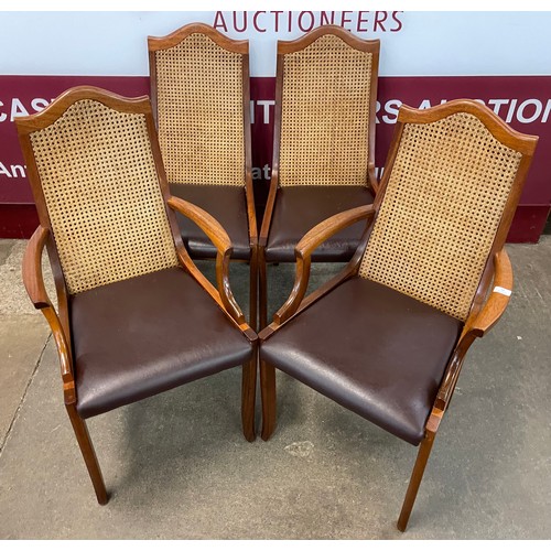 78 - A set of four teak, vinyl and bergere dining chairs