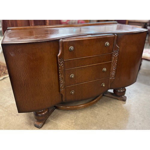 159 - An early 20th Century carved oak sideboard