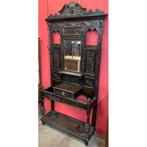 83 - A Victorian Jacobean Revival extensively carved oak hallstand