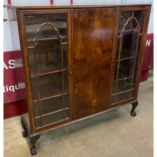 103 - An early 20th Century burr walnut three door bookcase