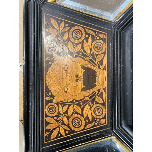 106 - A large Victorian ebonised and marquetry inlaid framed octagonal mirror