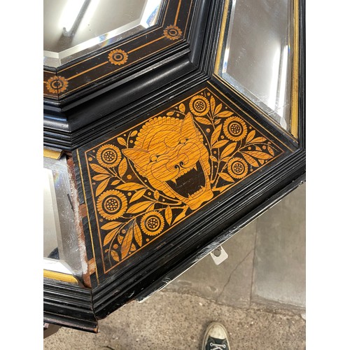 106 - A large Victorian ebonised and marquetry inlaid framed octagonal mirror